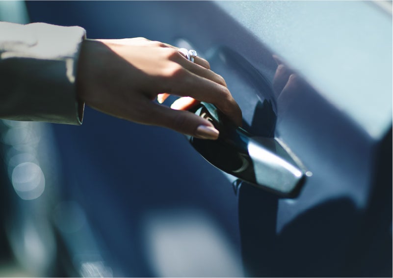 A hand gracefully grips the Light Touch Handle of a 2023 Lincoln Aviator® SUV to demonstrate its ease of use | Doggett Lincoln of Beaumont in Beaumont TX